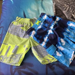 2 pairs Boys swim shorts one Nike and one cat and Jack